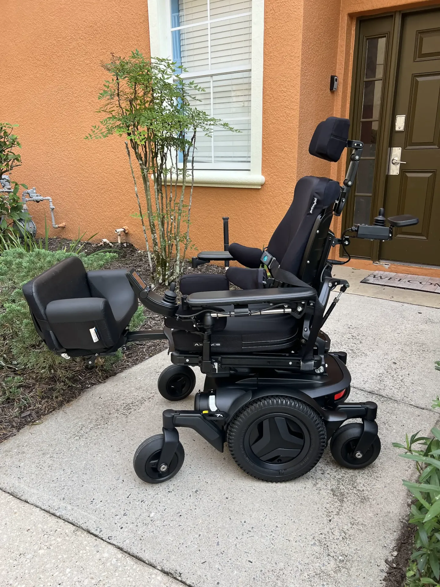 Permobil M3 Corpus power wheelchair in upright position, front view